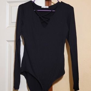 Long-sleeved body suit with criss-cross straps Size small